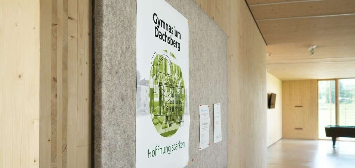 Grey felt panels as a pinboard and acoustic absorber.